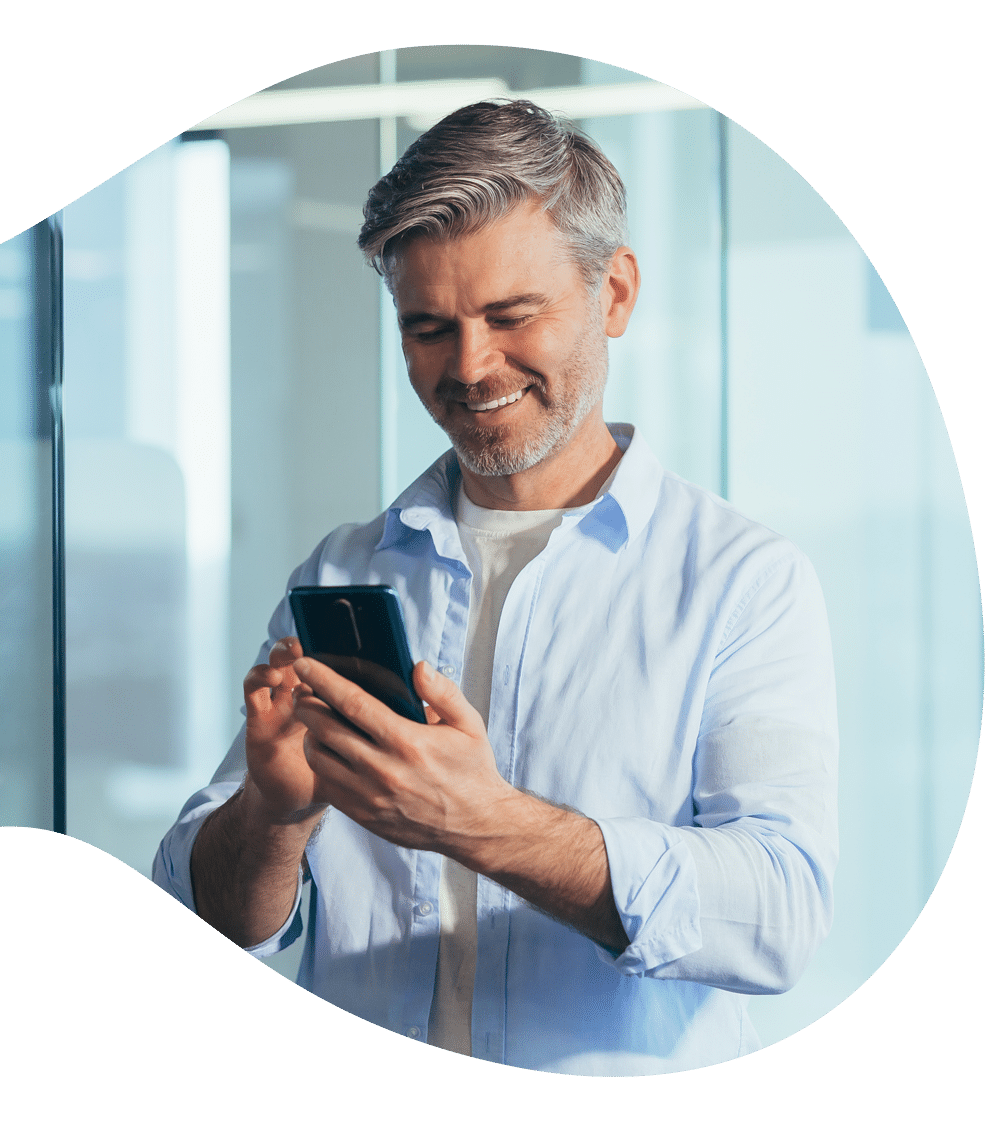 Prime Mix website Man smiling at his phone